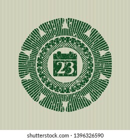 Green calendar icon inside rubber seal with grunge texture