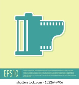 Green Camera vintage film roll cartridge icon isolated on yellow background. Film reel icon. 35mm film canister. Filmstrip photographer equipment. Flat design. Vector Illustration