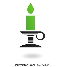 Green candle in candle holder isolated on white