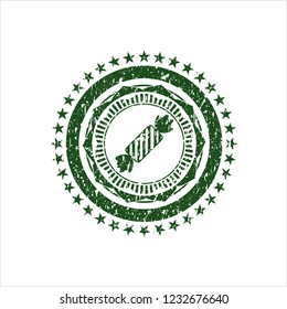 Green candy icon inside distressed rubber grunge texture seal