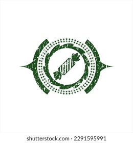 Icono verde de caramelo dentro de un estampado de estilo grunge angustiado. 
