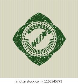Green candy icon inside grunge seal