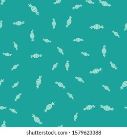 Green Candy icon isolated seamless pattern on green background.  Vector Illustration