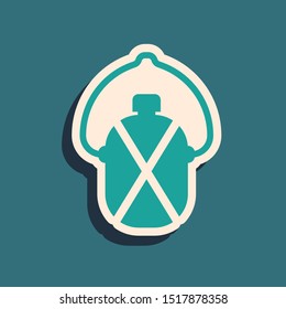Green Canteen water bottle icon isolated on blue background. Tourist flask icon. Jar of water use in the campaign. Long shadow style. Vector Illustration
