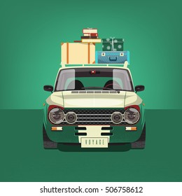Green car loaded with suitcases