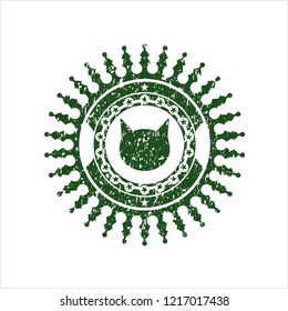 Green cat face icon inside distress rubber grunge texture stamp