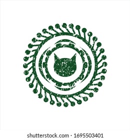 Green cat face icon inside rubber grunge texture stamp