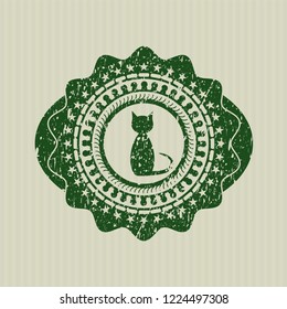 Green cat icon inside distress rubber stamp