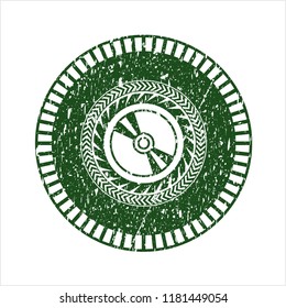 Green CD or DVD disc icon inside rubber texture