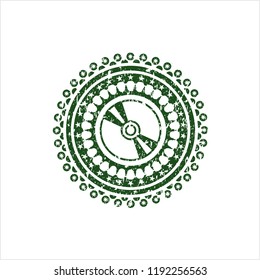 Green CD or DVD disc icon inside distressed rubber grunge stamp