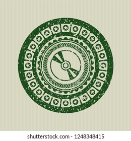 Green CD or DVD disc icon inside distressed with rubber seal texture