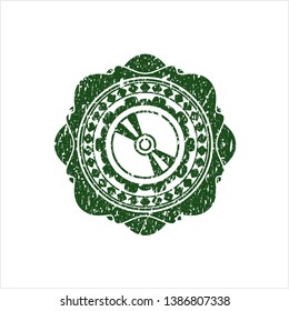 Green CD or DVD disc icon inside distressed with rubber seal texture