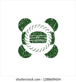 Green cheeseburger icon inside distress rubber stamp with grunge texture