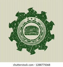 Green cheeseburger icon inside distressed rubber grunge stamp