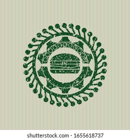 Green cheeseburger icon inside distressed rubber grunge texture stamp