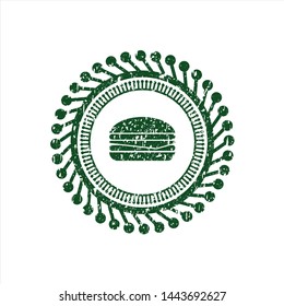 Green cheeseburger icon inside rubber grunge texture stamp