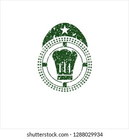Green chef hat icon inside distress rubber stamp with grunge texture