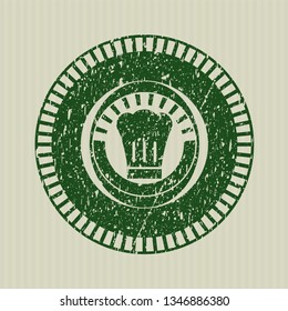 Green chef hat icon inside rubber grunge stamp