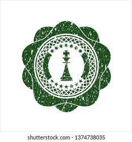 Green chess king icon inside distress grunge seal
