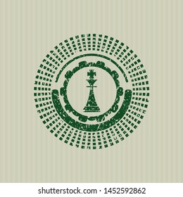 Green chess king icon inside distressed rubber grunge seal