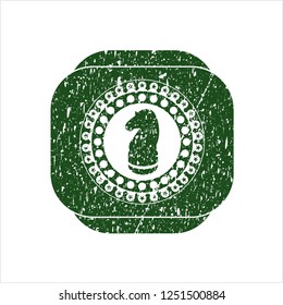 Green chess knight icon inside distress grunge style stamp