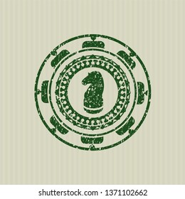 Green chess knight icon inside distress grunge seal