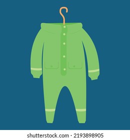Green children's overalls hanging on a trempel