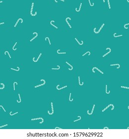 Green Christmas candy cane with stripes icon isolated seamless pattern on green background. Merry Christmas and Happy New Year.  Vector Illustration