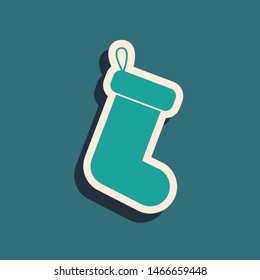 Green Christmas sock icon isolated on blue background. Long shadow style. Vector Illustration
