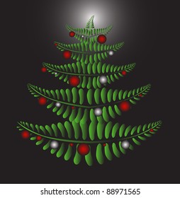 Green Christmas tree formed by fern leaves on the black background with red and silver Christmas balls