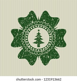 Green christmas tree icon inside distressed rubber grunge seal