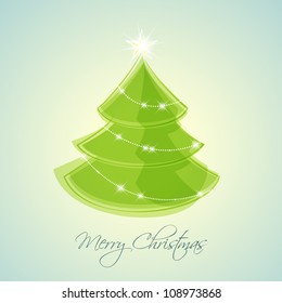 green Christmas tree on blue background