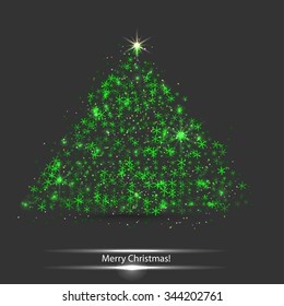 green christmas tree on dark background