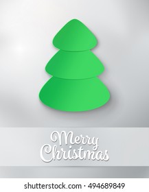 Green Christmas tree on grey background