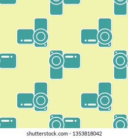 Green Cinema camera icon isolated seamless pattern on yellow background. Video camera. Movie sign. Film projector. Flat design. Vector Illustration