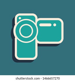 Green Cinema camera icon isolated on blue background. Video camera. Movie sign. Film projector. Long shadow style. Vector Illustration