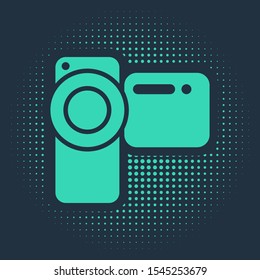 Green Cinema camera icon isolated on blue background. Video camera. Movie sign. Film projector. Abstract circle random dots. Vector Illustration