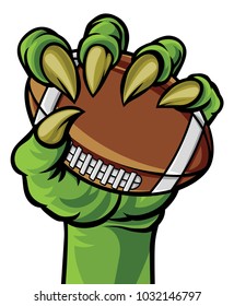 A green claw monster hand holding an American football ball
