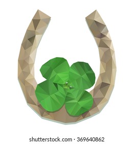Green clover and horseshoe on a white background. polygonal stylization