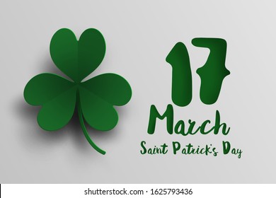 Green clover leaf in paper cut and St. Patrick's Day background