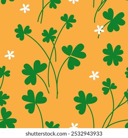 Green clover leaves with abstract shamrock flowers print on orange background. Decorative wallpaper for St Patrick's day holiday design. Vector stock illustration.