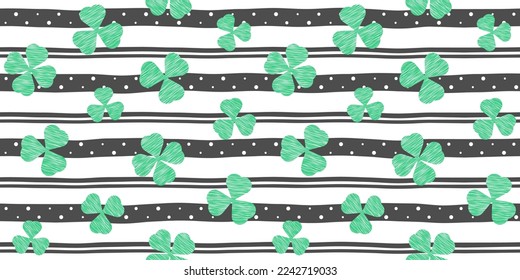 Green clover leaves with linear texture on a black and white striped background with dots. Endless texture with shamrock. Vector seamless pattern for St. Patrick's Day, wrapping paper, giftwrap, print