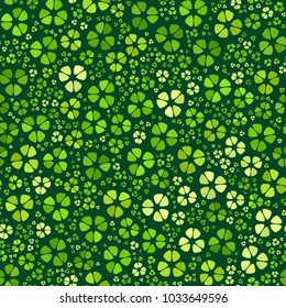 Green clover leaves mosaic texture isolated on dark background. Happy St. Patrick's Day shamrock wallpaper. Seamless pattern. Abstract geometric shapes gradient vector illustration