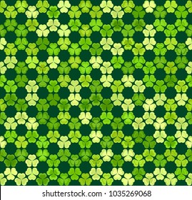 Green clover leaves mosaic texture isolated on dark background. Happy St. Patrick's Day shamrock wallpaper. Seamless pattern. Abstract geometric shapes gradient vector illustration