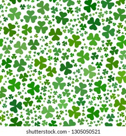 Green clover leaves mosaic texture isolated on white background. Happy St. Patrick's Day shamrock wallpaper. Seamless pattern. Abstract geometric shapes gradient vector illustration