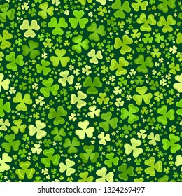 Green clover leaves mosaic texture isolated on dark background. Happy St. Patrick's Day shamrock wallpaper. Seamless pattern. Abstract geometric shapes gradient vector illustration