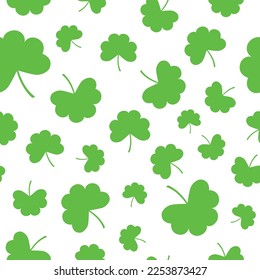 Green clover leaves on white background. Floral seamless pattern. Best for textile, wallpapers, wrapping paper, package, home decor and St Patrick's day decoration.
