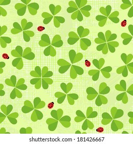 Green clover meadow with little ladybirds shamrock St Patrick Day holiday spring seamless pattern on light green background
