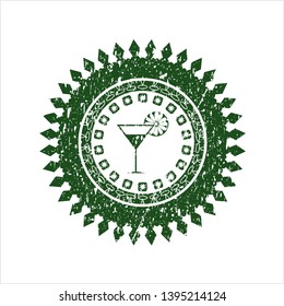 Green cocktail glass icon inside distressed rubber seal