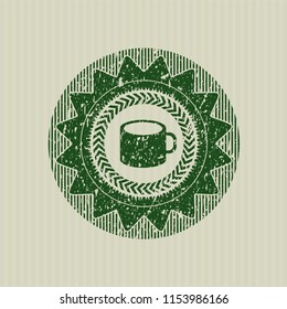 Green coffee cup icon inside distress grunge seal